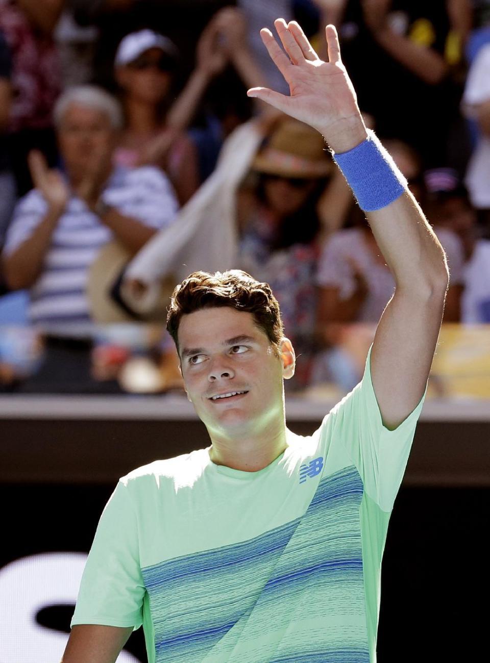 Canada's Milos Raonic waves to the spectators after defeating Luxembourg's Gilles Muller in their second round match at the Australian Open tennis championships in Melbourne, Australia, Thursday, Jan. 19, 2017. (AP Photo/Aaron Favila)