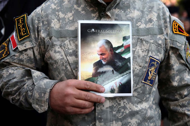 A demonstrator holds the picture of Qassem Soleimani during a protest against the assassination of the Iranian Major-General Qassem Soleimani, head of the elite Quds Force,