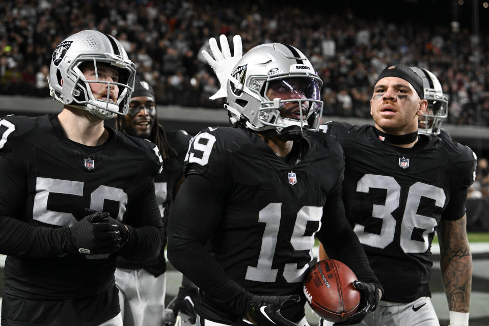 LAS VEGAS, NEVADA – DECEMBER 14: Wide receiver DJ Turner #19 of the Las Vegas Raiders celebrates with teammates after recovering a fumble against the Los Angeles Chargers during the second quarter at Allegiant Stadium on December 14, 2023 in Las Vegas, Nevada. The Raiders defeated the Chargers 63-21. (Photo by Candice Ward/Getty Images)