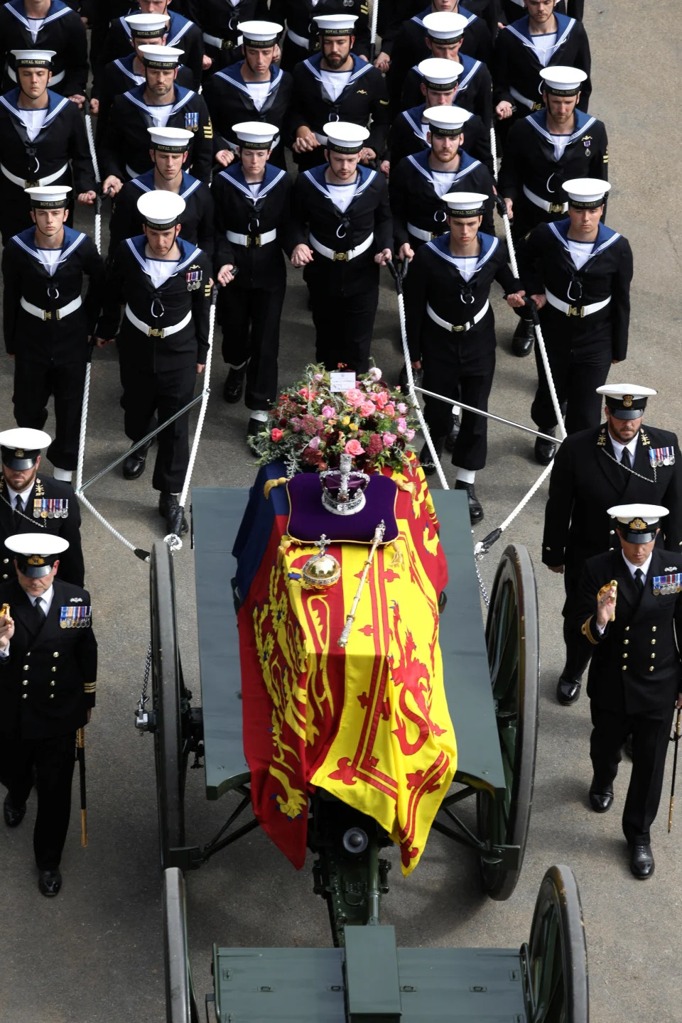 Pictured: The State Gun Carriage, which was pulled by 142 Naval Ratings carrying the coffin of Her Majesty Queen Elizabeth II moves along the Procession route, up Constitution Hill.    The UK Armed Forces have played a part in the procession for Her Majesty The Queen?s funeral and committal service today, in London and Windsor.    Marking the end to 10 days of proceedings, service personnel representing a variety of regiments, ships and air stations that held a special relationship with Her Majesty The Queen took part in the funeral processions in London and Windsor.    Around 4,000 regular and reserve soldiers, sailors, marines and aviators, as well as musicians from Armed Forces bands, took part in the proceedings today. This included over 3,000 military personnel in central London, with 1,650 personnel forming part of the procession from the Palace of Westminster to Westminster Abbey and procession from Westminster Abbey to Wellington Arch.    In Windsor, over 1,000 military personnel were involved in ceremonial activity, including 410 taking part in the procession from Albert Road, Windsor, to St George?s Chapel, Windsor Castle.    Cpl Tim Hammond/Pool via REUTERS