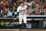 Houston Astros' Carlos Correa watches his RBI ground-rule double against the Chicago White Sox during the fourth inning of a baseball game Thursday, June 17, 2021, in Houston. (AP Photo/David J. Phillip)