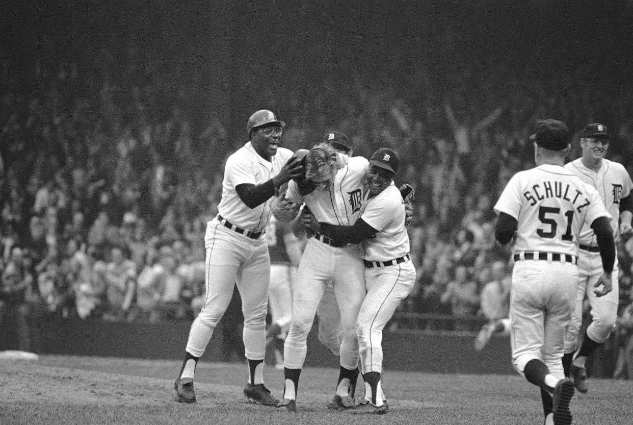 Detroit Tigers Ike Brown, left, and Tony Taylor, right, embrace Jim Northrup near home plate after his single drove in the Tigers winning run in 10th inning in an ALCS game with the Oakland Athletics in Detroit on Oct. 11, 1972. With the bases loaded, Northrup singled to right field over head of Matty Alou to put the Tigers in front 4-3 and a win to even up the playoff series at 2-2. AP FILE PHOTO