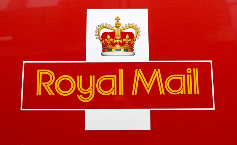 FILE PHOTO: A Royal Mail sign is pictured on a delivery van outside a Post Office, in St Albans