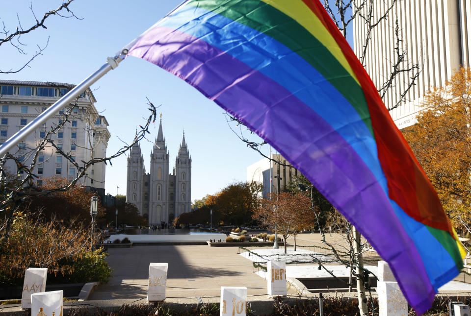 A pride flag flies in front of the Historic Mormon Temple as part of a protest where people resigned from the Church of Jesus Christ of Latter-Day Saints in response to a change in church policy towards married LGBT same-sex couples and their children. (Photo: George Frey via Getty Images)