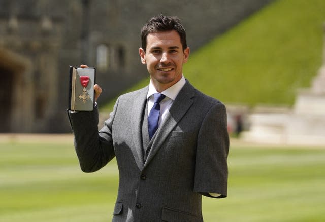 Jaco van Gass with his MBE following an investiture ceremony at Windsor Castle