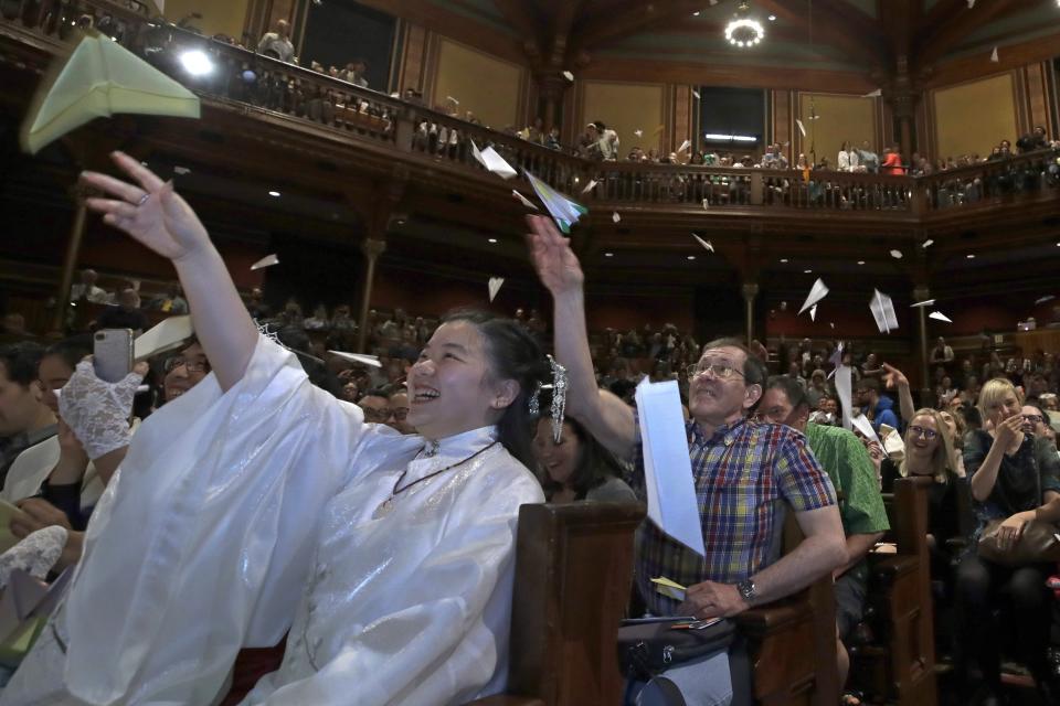 FILE - Audience members toss paper airplanes during the Ig Nobel awards ceremony at Harvard University, in Cambridge, Mass, Sept. 12, 2019. The 32nd annual Ig Nobel prize ceremony on Thursday, Sept. 15, 2022, was for the third year in a row a prerecorded affair because of the lingering effects of the coronavirus pandemic. (AP Photo/Elise Amendola, File)