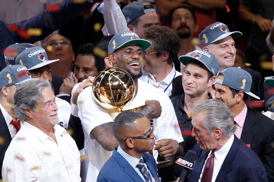 MIAMI, FL - JUNE 21: LeBron James #6 of the Miami Heat celebrates with the Larry O'Brien Finals Championship trophy after they won 121-106 against the Oklahoma City Thunder in Game Five of the 2012 NBA Finals on June 21, 2012 at American Airlines Arena in Miami, Florida. NOTE TO USER: User expressly acknowledges and agrees that, by downloading and or using this photograph, User is consenting to the terms and conditions of the Getty Images License Agreement. (Photo by Mike Ehrmann/Getty Images)