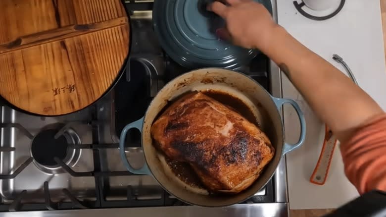 putting the lid on a pork roast butt