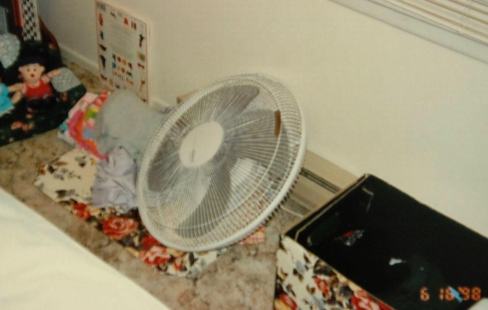 a fan on a bed