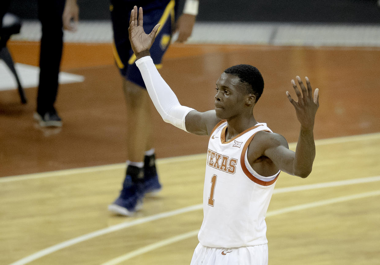 Texas guard Andrew Jones gestures to the crowd during the team's NCAA college basketball game against Northern Colorado on Tuesday, Nov. 5, 2019, in Austin, Texas. (Nick Wagner/Austin American-Statesman via AP)