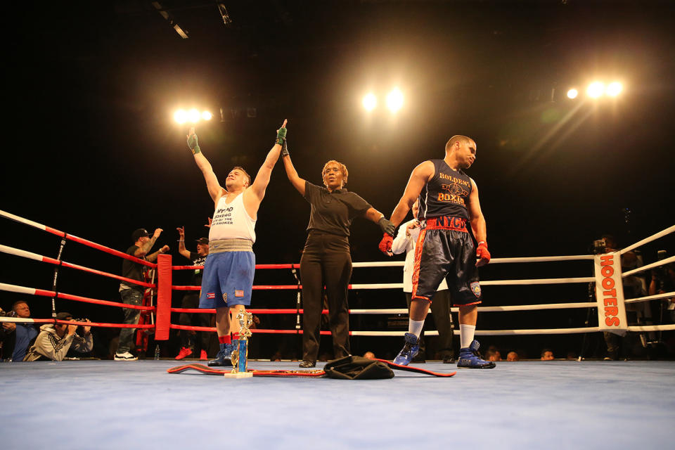 <p>New York’s Finest Javier Colon shows his disappointment after losing a split decision to Eddie Bermudez, left, in the NYPD Boxing Championships at the Theater at Madison Square Garden on June 8, 2017. (Photo: Gordon Donovan/Yahoo News) </p>