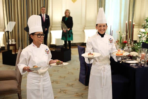 White House executive chef Cris Comerford (L) and White House executive pastry chef Susie Morrison speak about the upcoming State Dinner for French president Macron, at the White House on 30 November 2022 in Washington, DC (Getty Images)
