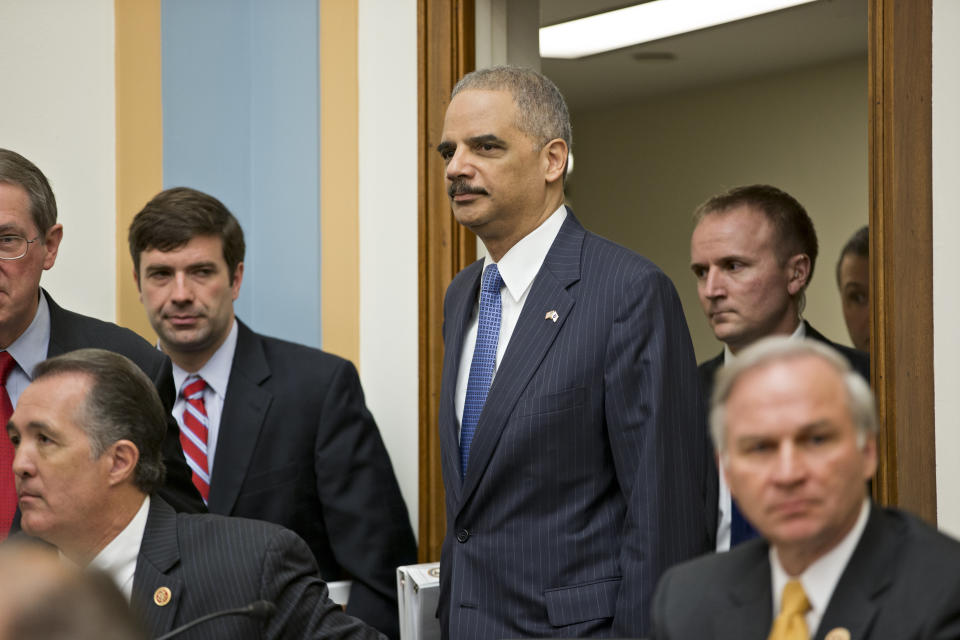 Attorney General Eric Holder, the nation's top law enforcement official, arrives on Capitol Hill in Washington, Wednesday, May 15, 2013, to testify before the House Judiciary Committee oversight hearing on the Justice Department. House Judiciary Committee Chairman Rep. Bob Goodlatte,R-Va., wants to know more about the unwarranted targeting of Tea Party and other conservative groups by the Internal Revenue Service and the Justice Department's secret seizure of telephone records at The Associated Press. (AP Photo/J. Scott Applewhite)