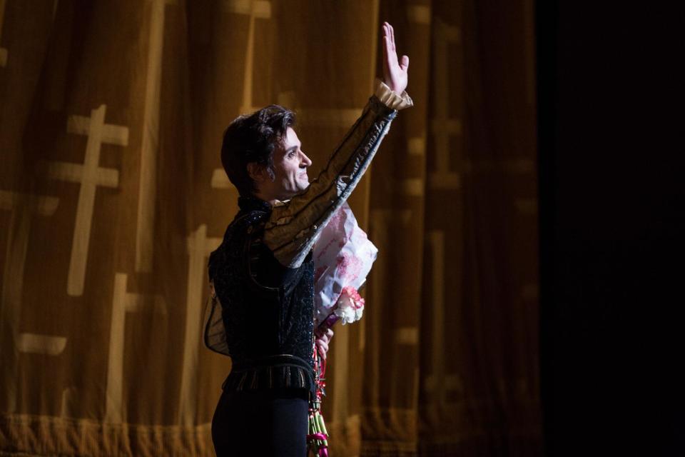 In this June 28, 2012 photo provided by American Ballet Theatre, Angel Corella waves to the audience after his retirement performance of “Swan Lake” with the American Ballet Theatre at the Metropolitan Opera House in New York. (AP Photo/American Ballet Theatre, Rosalie O'Connor)