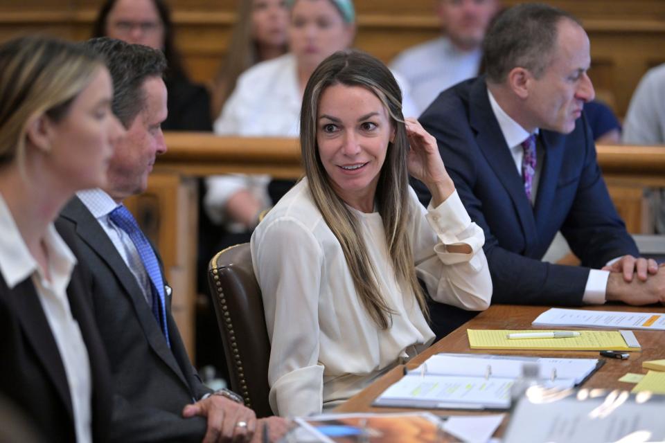 Karen Read, center, reacts to testimony from Dr. Irini Scordi-Bello, a medical examiner for the state's medical examiner's office during Read's trial in Norfolk Superior Court, Friday, June 21, 2024, in Dedham, Mass. (AP Photo/Josh Reynolds, Pool)