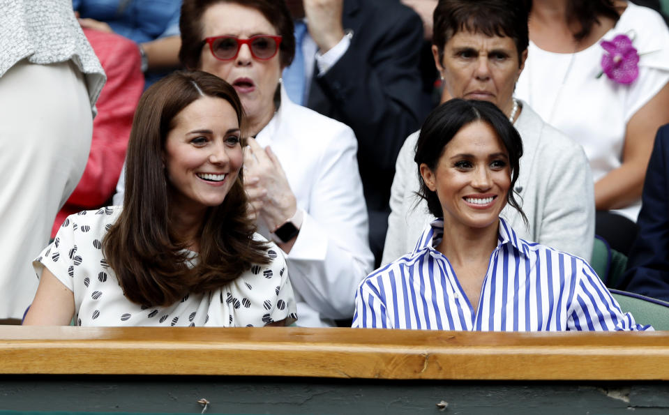 The Duchess of Cambridge and the Duchess of Sussex in the royal box on centre court on day twelve of the Wimbledon Championships at the All England Lawn Tennis and Croquet Club, Wimbledon.