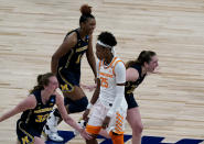 Michigan players celebrate while Tennessee guard Jordan Horston (25) walks off the court after their college basketball game in the second round of the women's NCAA tournament at the Alamodome in San Antonio, Tuesday, March 23, 2021. Michigan won 70-55. (AP Photo/Charlie Riedel)