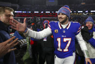 Buffalo Bills quarterback Josh Allen (17) walks off the field after defeating the Pittsburgh Steelers in an NFL wild-card playoff football game, Monday, Jan. 15, 2024, in Buffalo, N.Y. (AP Photo/Jeffrey T. Barnes)