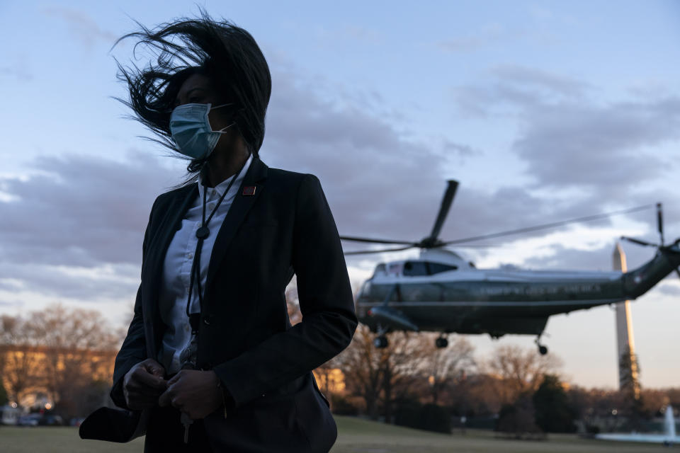The rotor wash from Marine One, with President Joe Biden aboard, blows the hair of U.S. Secret Service Special Agent upon lift off from the South Lawn of the White House, Friday, Feb. 5, 2021, in Washington. (AP Photo/Alex Brandon)