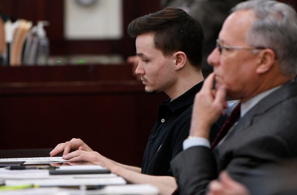 Michael Mosely sits in court while a witness testifies during his trial at Justice A. A. Birch Building in Nashville , Tenn., Tuesday, March 29, 2022. Mosely was charged with two counts of first-degree murder and one each of attempted first-degree murder and assault in connection to a fatal 2019 stabbing at a midtown bar.