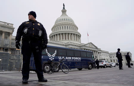 A U.S. Air Force bus meant to transport U.S. Speaker of the House Nancy Pelosi and other members of Congress to a flight to Belgium and Afghanistan sits in front of the U.S. Capitol after President Donald Trump cancelled the Air Force flight as the president's dispute with congressional Democrats over the partial government shutdown continues in Washington, U.S., January 17, 2019. REUTERS/Joshua Roberts