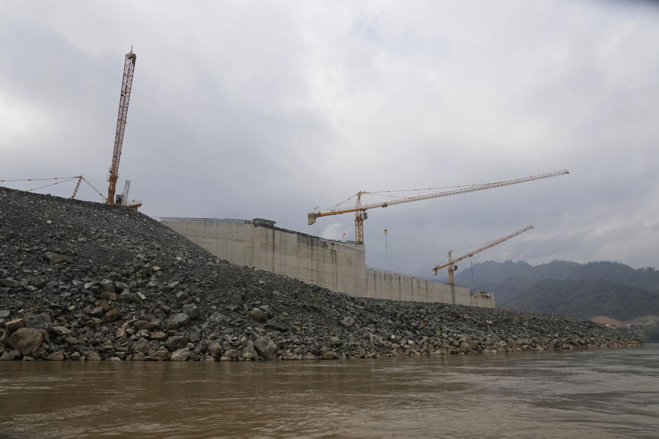 Construction site of Luang Prabang dam is seen near Mekong river in Luang Prabang, Laos, Sunday, Jan. 28, 2024. Luang Prabang was named a UNESCO World Heritage Site nearly 30 years ago, but a multibillion-dollar dam project is raising questions that could deprive the city of its coveted status and prompting broader concerns the Mekong River could be ruined by multiple dams that are being planned. (AP Photo/Sakchai Lalit)