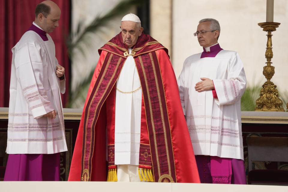 Pope Francis arrives on the altar to celebrate the Palm Sunday's mass in St. Peter's Square at The Vatican Sunday, April 2, 2023 a day after being discharged from the Agostino Gemelli University Hospital in Rome, where he has been treated for bronchitis, The Vatican said. The Roman Catholic Church enters Holy Week, retracing the story of the crucifixion of Jesus and his resurrection three days later on Easter Sunday. (AP Photo/Andrew Medichini)