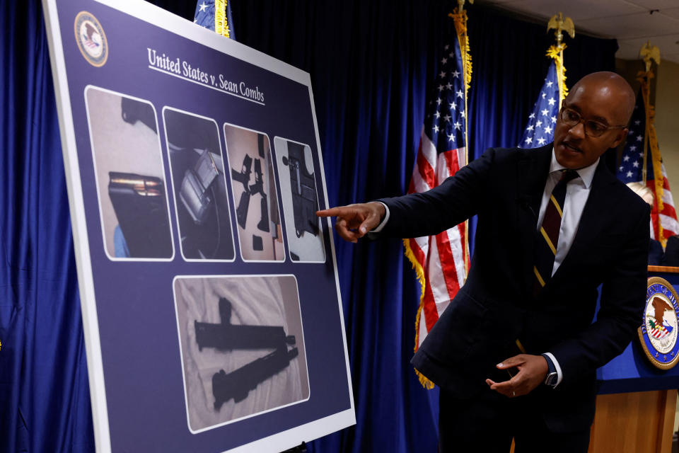 US Attorney Damian Williams points to a graph during a press conference to announce the release of charges against music mogul Sean 