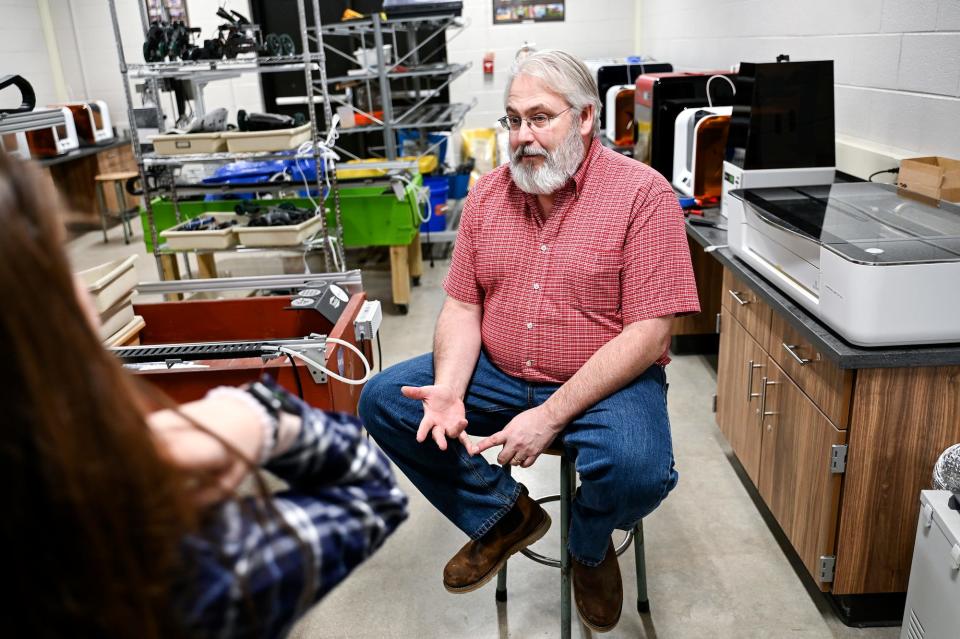 Robotics teacher Bob Richards talks with students during class on Tuesday, Feb. 7, 2023, at Stockbridge High School.