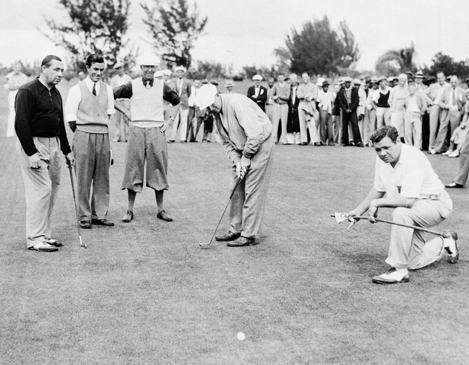 Babe Ruth, far right, acts as referee in the International Four Ball Tournament on opening day in Miami, Fla., March 9, 1936.  Walter Hagen, left, and Johnny Farrell, second from left, lost their opening match to Willie MacFarlane, third from left, and Willie Kline, putting.