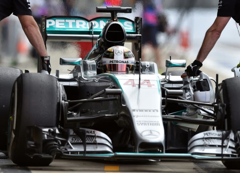 Mercedes AMG Petronas F1 Team's British driver Lewis Hamilton arrives in the pits during the second practice session at the Silverstone circuit in Silverstone on July 2, 2015 ahead of the British Formula One Grand Prix