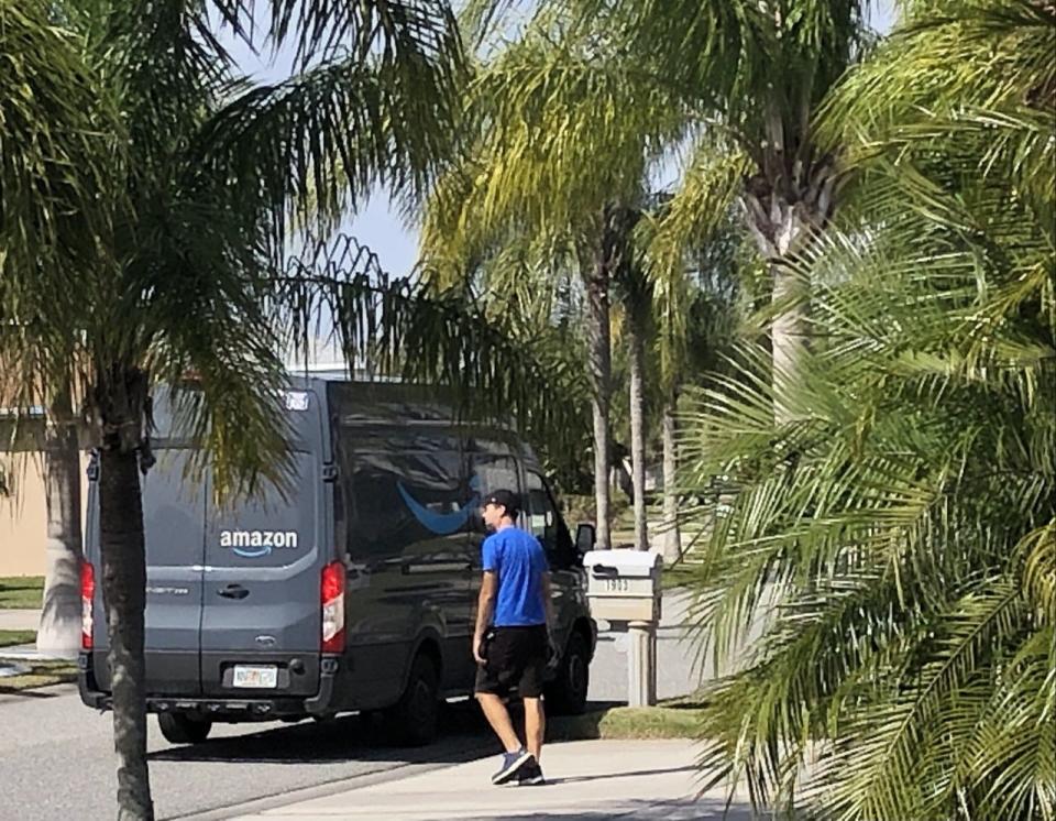 An Amazon driver returns to his vehicle after making a delivery in Viera. A new survey by JLL, which manages a number of retail centers nationwide, found that Amazon is the most popular venue to purchase holiday gifts. The survey said 64.3% of holiday shoppers planned to do at least some holiday shopping via Amazon.