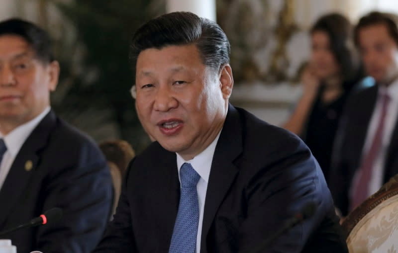 FILE PHOTO: Chinese President Xi Jinping speaks during a meeting with then-U.S. President Donald Trump at Trump's Mar-a-Lago estate in Palm Beach, Florida