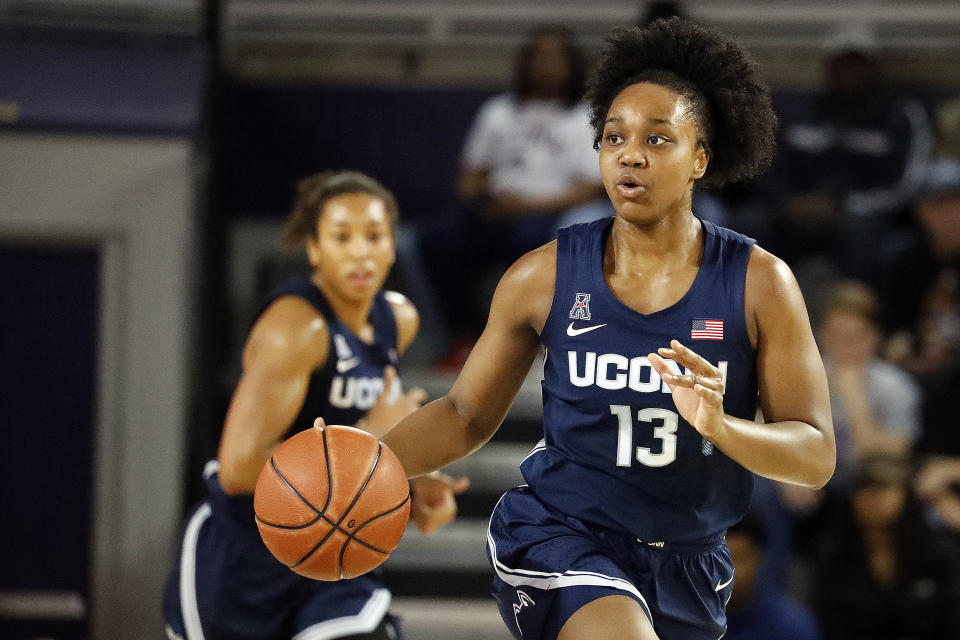 Connecticut's Christyn Williams (13) brings the ball up the court against East Carolina during the first half of an NCAA college basketball game, Saturday, Jan. 25, 2020 in Greenville, N.C. (AP Photo/Karl B DeBlaker)