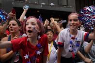 People wave the players of the U.S Women's National Soccer team during a Victory Parade and City Hall Ceremony in New York, United States on July 10, 2019. The U.S. won the 2019 FIFA Women's World Cup, beating the Netherlands 2-0 in the final on Sunday in the French city of Lyon. (Photo by Vural Elibol/Anadolu Agency/Getty Images)