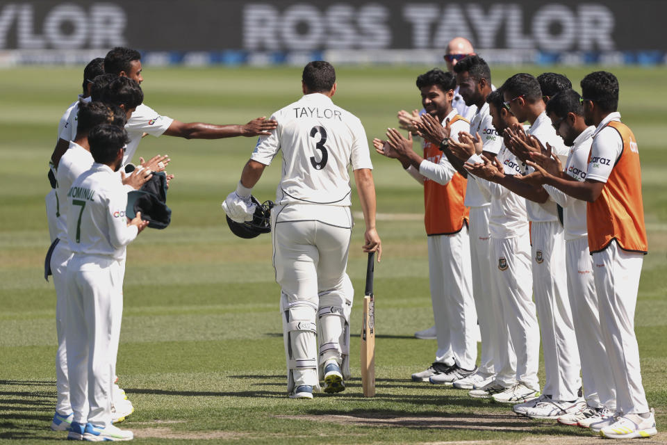 Ross Taylor is welcomed on to the field by the Bangladesh players on day two of the second cricket test between Bangladesh and New Zealand at Hagley Oval in Christchurch, New Zealand, Monday, Jan. 10, 2022. (Martin Hunter/Photosport via AP)