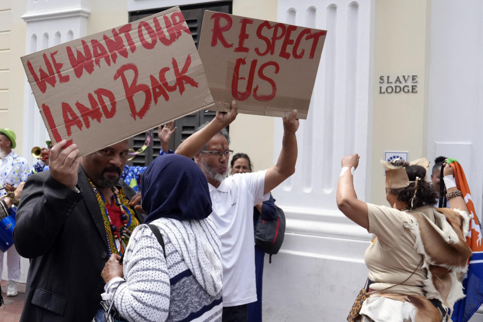 Khoisan protesters protest during the visit of King Willem Alexander and Queen Maxima of the Netherlands at the Slave Lodge in Cape Town, South Africa, Friday, Oct. 20, 2023. The king and queen of the Netherlands were confronted by angry protesters in South Africa on a visit Friday to a monument that traces part of their country's involvement in slavery as a colonial power 300 years ago. (AP Photo/Nardus Engelbrecht)