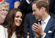 Britain's Prince William and his wife Catherine, Duchess of Cambridge applaud on Centre Court after Roger Federer of Switzerland defeated Mikhail Youzhny of Russia in their men's quarter-final tennis match at the Wimbledon tennis championships in London July 4, 2012. REUTERS/Stefan Wermuth