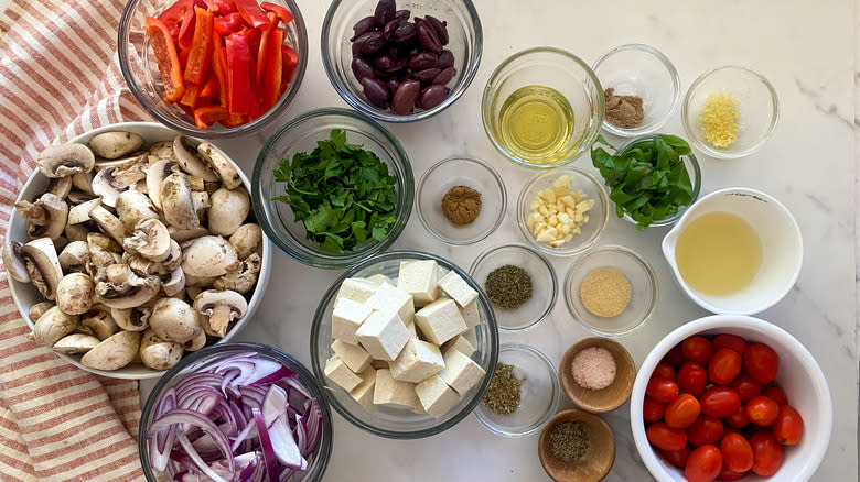 Mediterranean sheet pan tofu ingredients in glass bowls