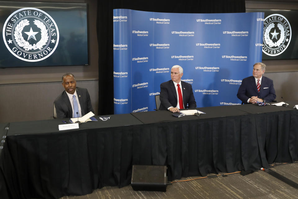 Housing and Urban Development Secretary Ben Carson, left, makes comments as Vice President Mike Pence, center, and Texas Gov. Greg Abbott, right, look on during a news conference after Pence met with Abbott and members of his health care team regarding COVID-19 at the University of Texas Southwestern Medical Center West Campus in Dallas, Sunday, June 28, 2020. (AP Photo/Tony Gutierrez)