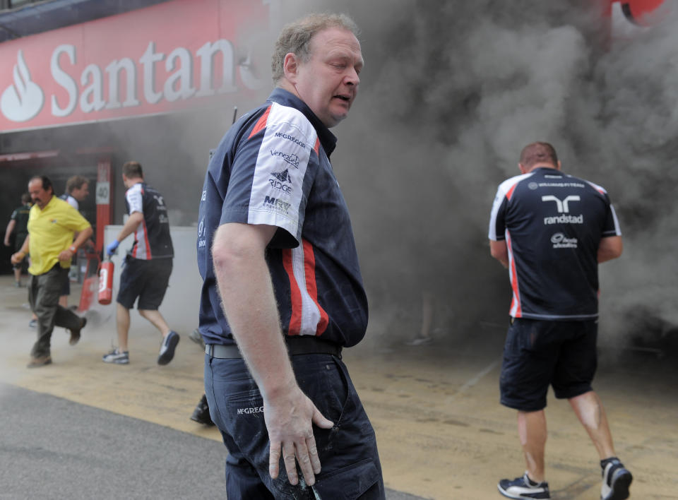 Racing team crews try to extinguish a fire in the Williams racing pit stand at the Circuit de Catalunya on May , 2012 in Montmelo on the outskirts of Barcelona after the Spanish Formula One Grand Prix. AFP PHOTO / JOSEP LAGOJOSEP LAGO/AFP/GettyImages