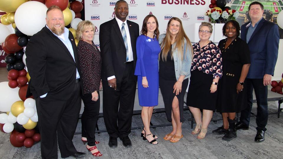 Amy Henderson, fourth from left, and Alyssa Lewis, fourth from right, recently were presented Small Business Awards by the U.S. Small Business Administration. Also pictured are, from left, Matt Jock, Kim Voss and Rey Lops of the U.S. Small Business Administration; Gina Woodward, America’s SBDC at WTAMU; and Carla Holland and Randy Burch of America’s SBDC at TTU – Northwest Texas State Office.