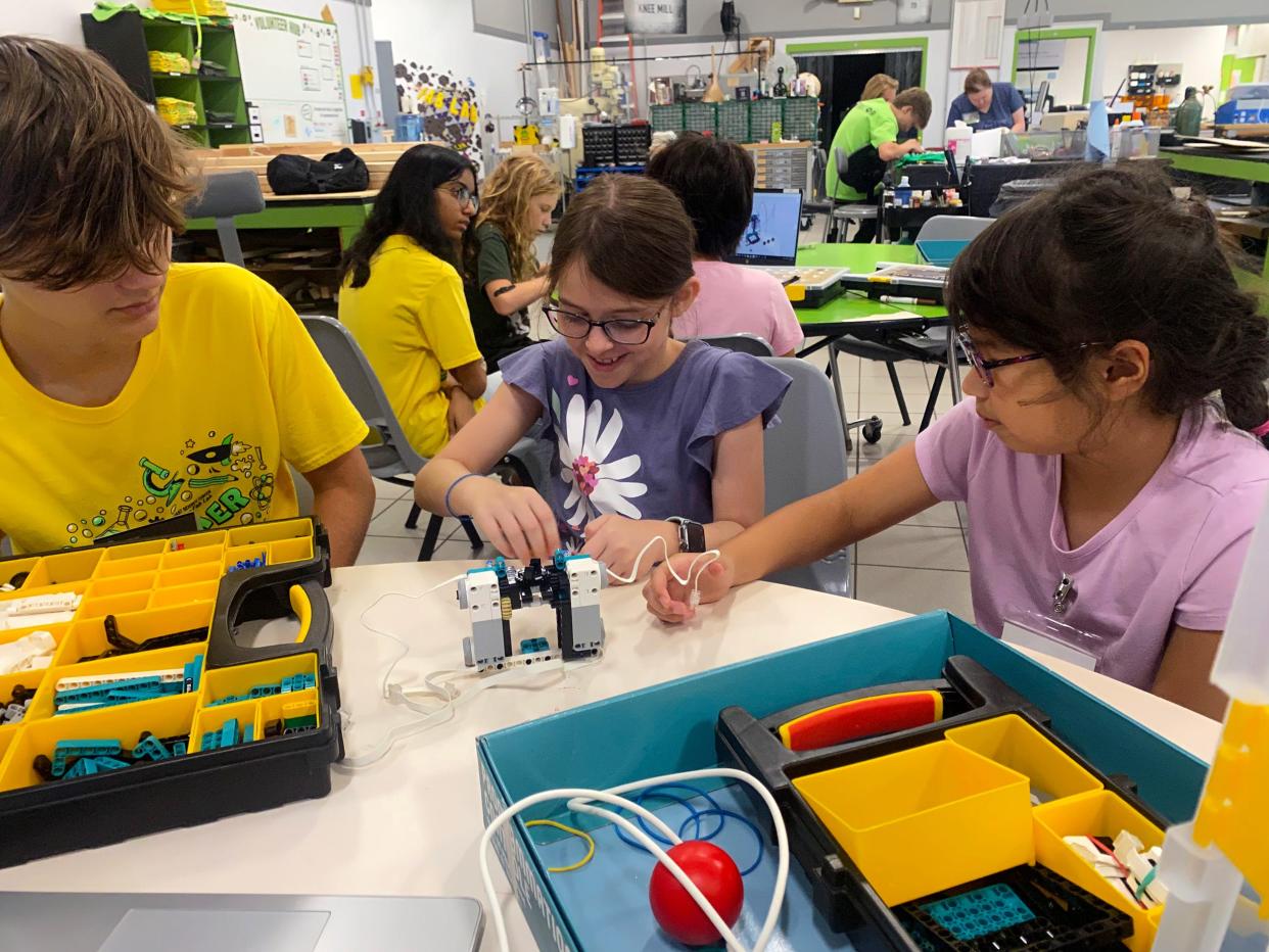 Faulhaber Fab Lab students build a LEGO robot with the help of a student volunteer. The Fab Lab is launching a FIRST LEGO League robotics program in January.