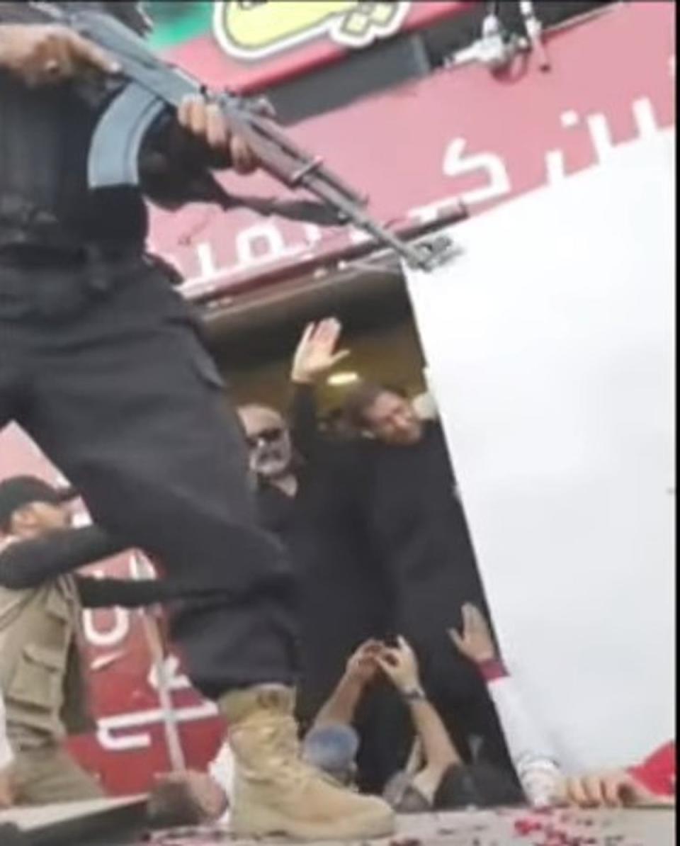 Mr Khan is seen waving in video footage of the aftermath as he is taken to hospital in Lahore (Pakistan Tehreek-e-Insaf)