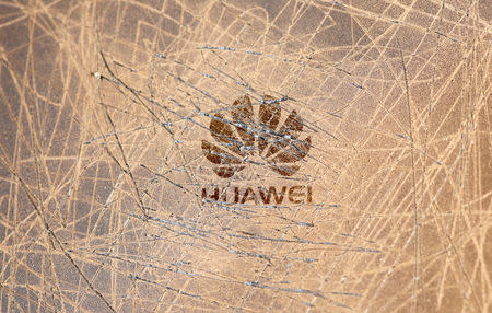 FILE PHOTO: A scratched surface Huawei logo is seen on a smarthphone in this illustration picture taken May 20, 2019. REUTERS/Dado Ruvic/Illustration/File Photo