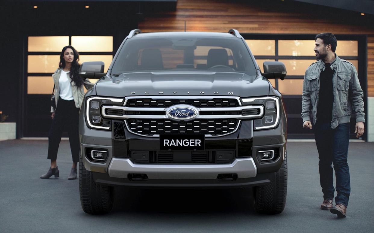 A young couple approach their Ford Ranger Platinum