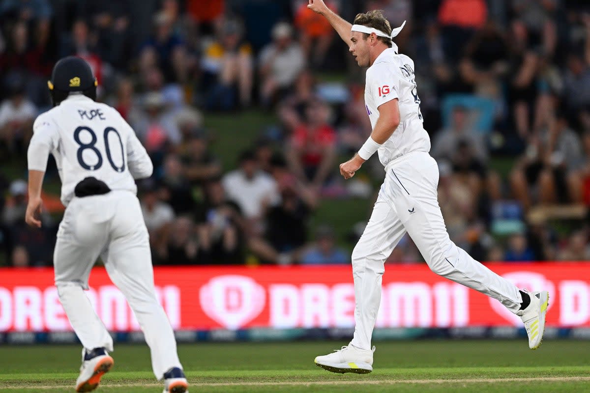 Stuart Broad, right, celebrates the wicket of New Zealand’s Devon Conway (Andrew Cornaga/Photosport via AP) (AP)