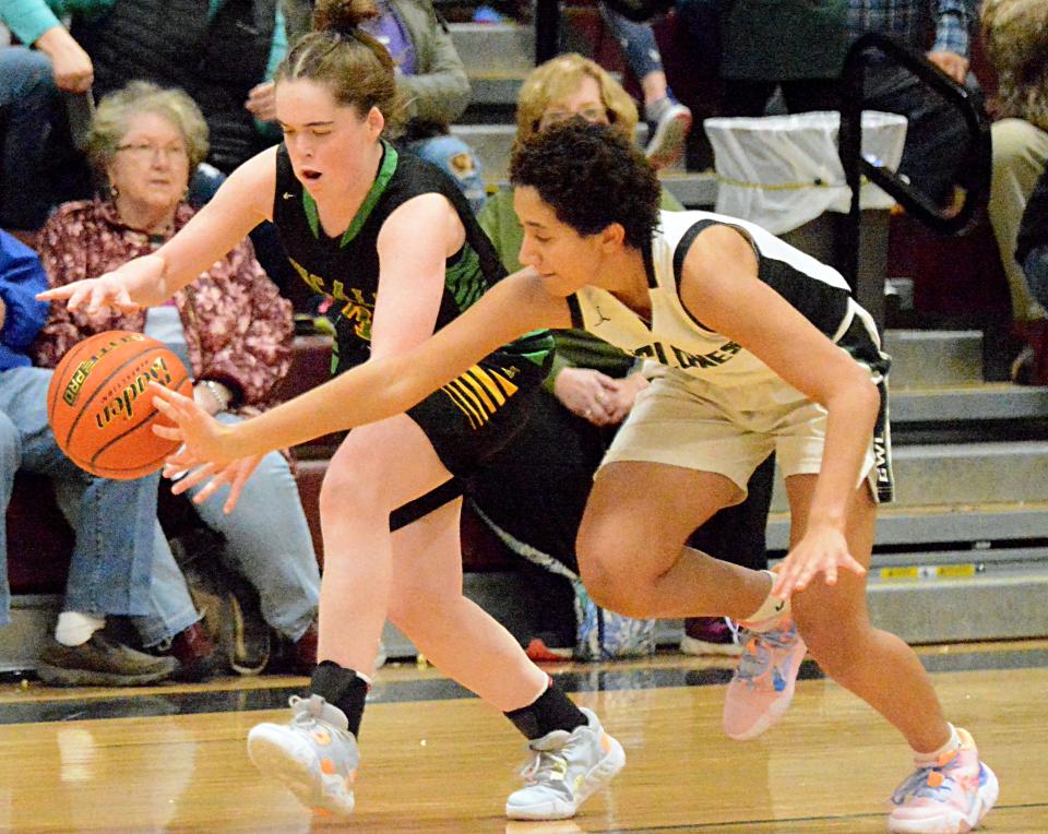 Aberdeen Roncalli's Maddie Huber makes a steal against Clark-Willow Lake's Musonda Kabwe during their Northeast Conference high school basketball doubleheader on Thursday, Jan. 19, 2023 in Clark.