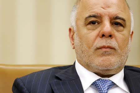 FILE PHOTO: Iraq's Prime Minister Haider al-Abadi listens to remarks to reporters by U.S. President Barack Obama after their bilateral meeting in the Oval Office at the White House in Washington April 14, 2015. REUTERS/Jonathan Ernst/File Photo