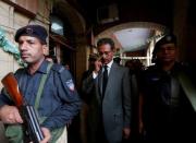 Waseem Akhtar, mayor nominee of Muttahida Qaumi Movement (MQM) political party gets escorted by placemen after the ballot for mayor at the Municipal Corporation Building in Karachi, Pakistan, August 24, 2016. REUTERS/Akhtar Soomro?